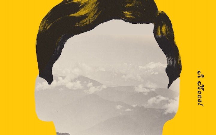 A cut-out of a male head against a bright yellow background, the facial features blank and replaced by a mountain landscape.